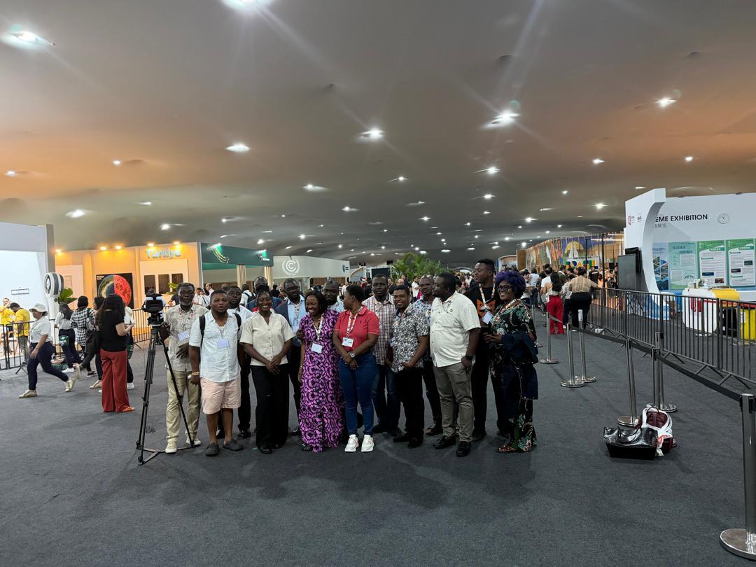 A group gathering in a climate conference exhibition hall