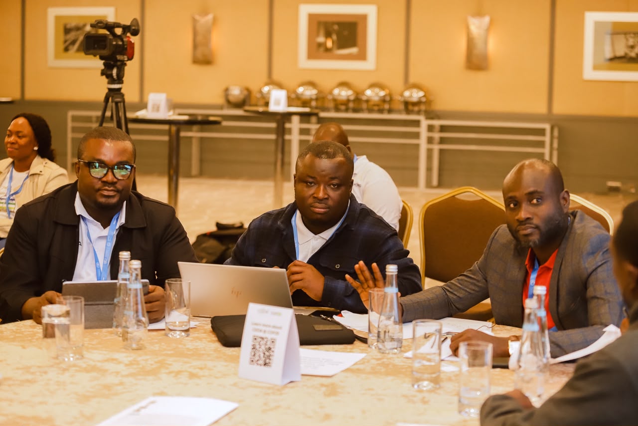 Participants sharing ideas around a workshop table