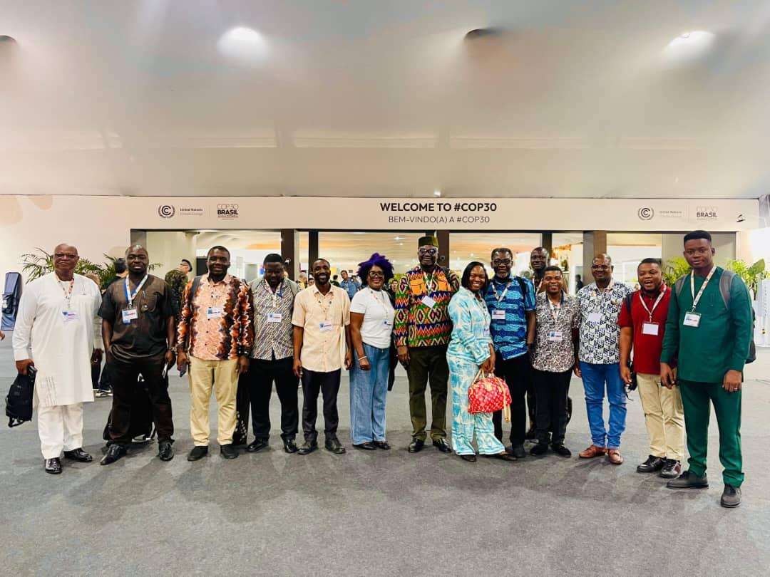 A group photograph at the COP30 entrance